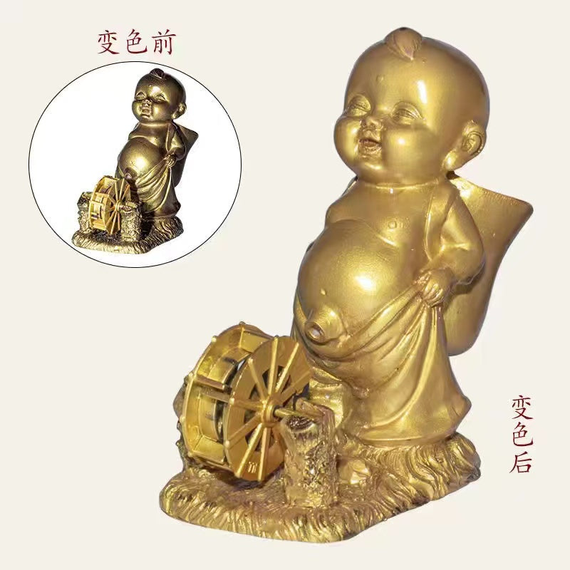 Pissing child with a spinning wheel color changing tea pet