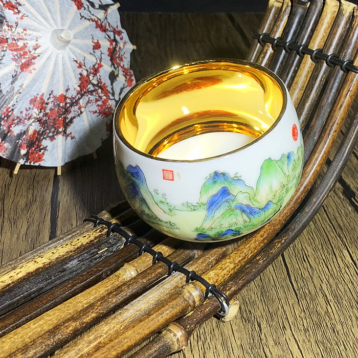 Hand painted golden tea cup in the painting of green thousand miles of rivers and mountains