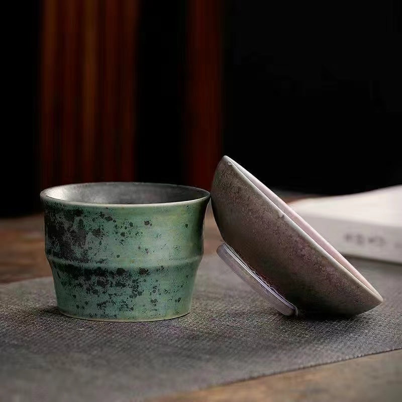 A kiln-formed cranes and celestial cranes teapot in rough earthenware Vintage teapot