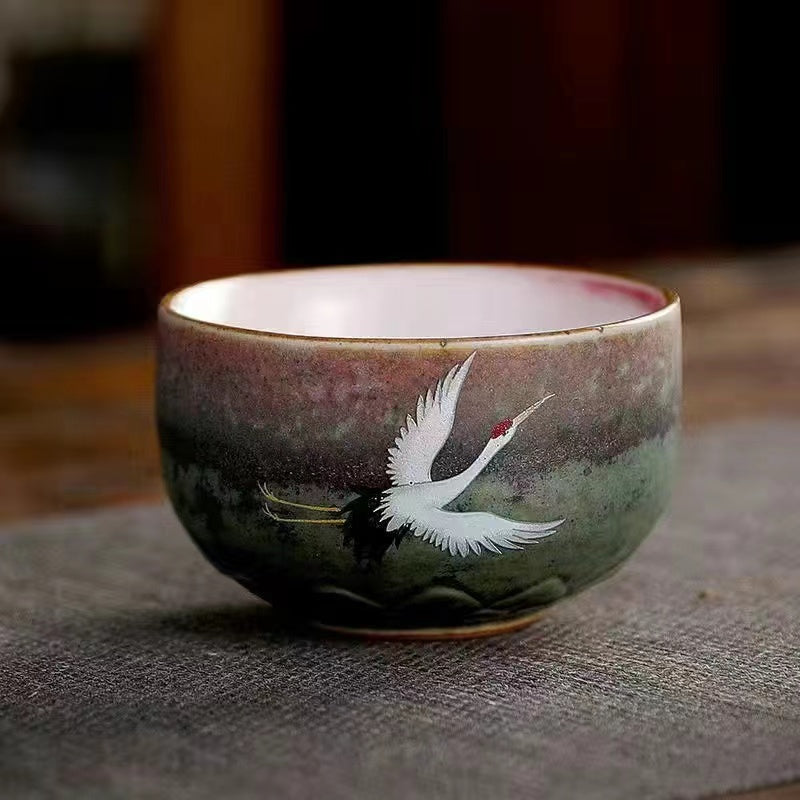 A kiln-formed cranes and celestial cranes teapot in rough earthenware Vintage teapot