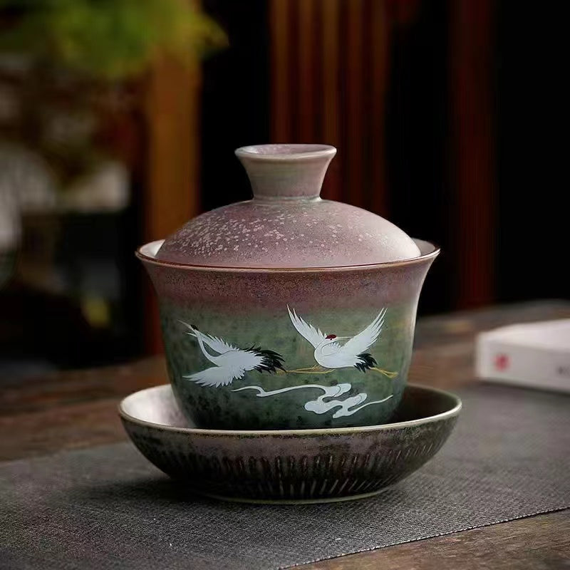 A kiln-formed cranes and celestial cranes teapot in rough earthenware Vintage teapot