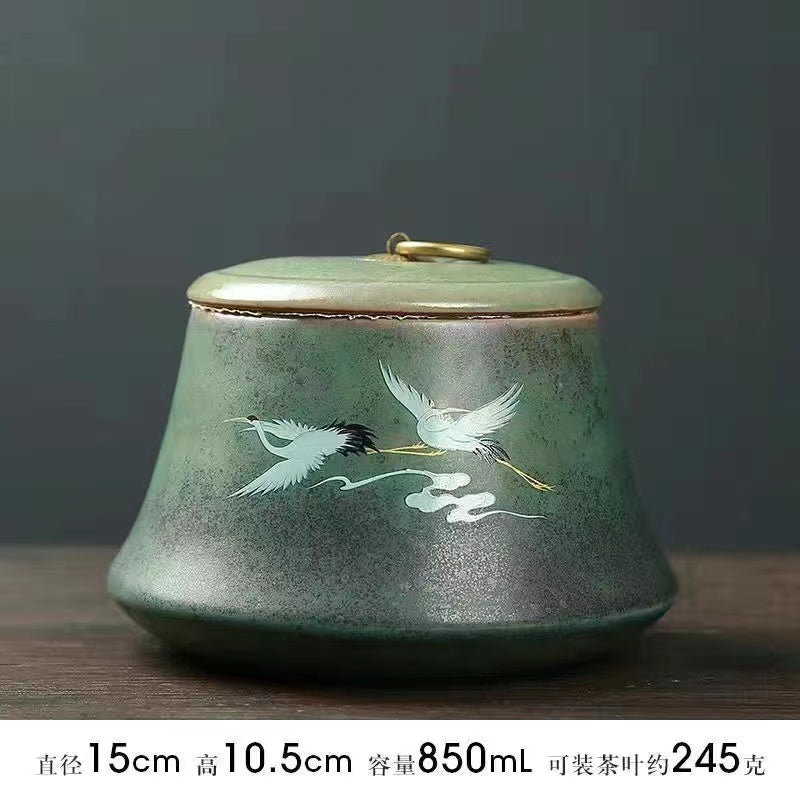 A kiln-formed crane tea jar