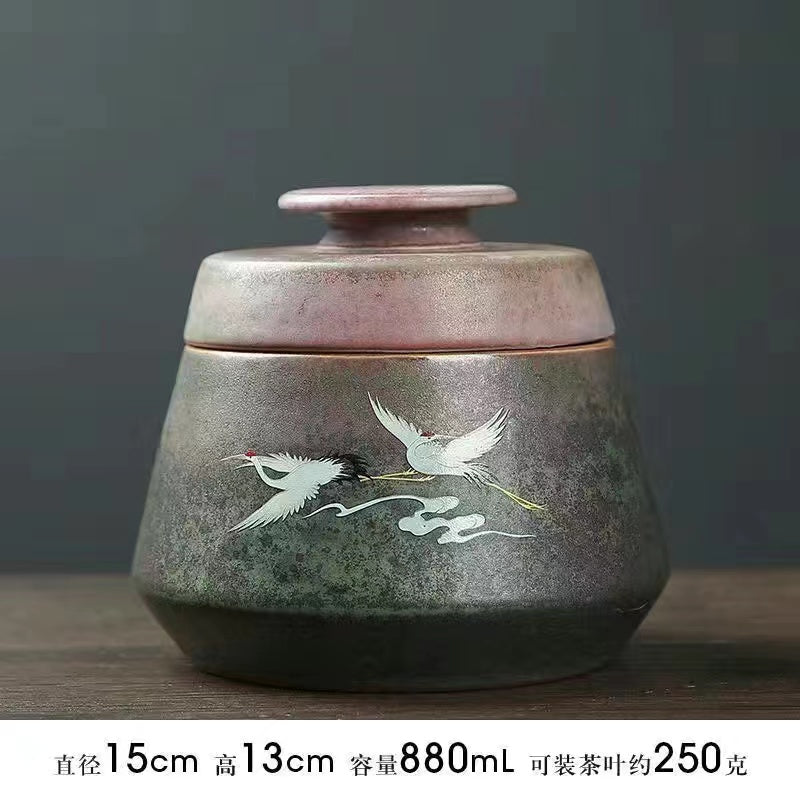 A kiln-formed crane tea jar