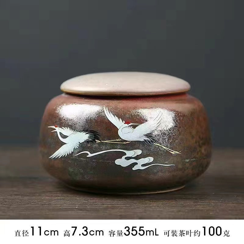 A kiln-formed crane tea jar