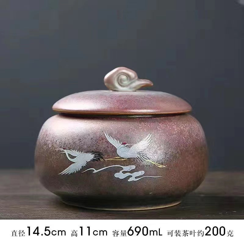 A kiln-formed crane tea jar