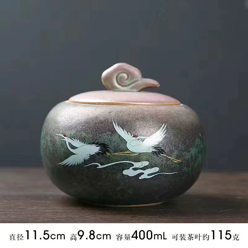 A kiln-formed crane tea jar