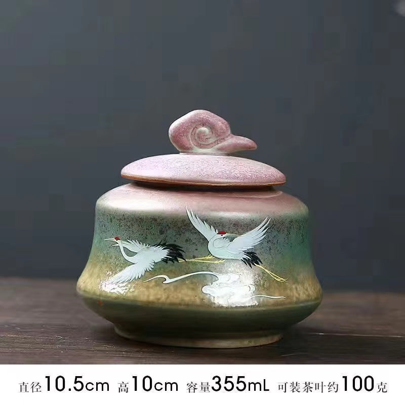 A kiln-formed crane tea jar