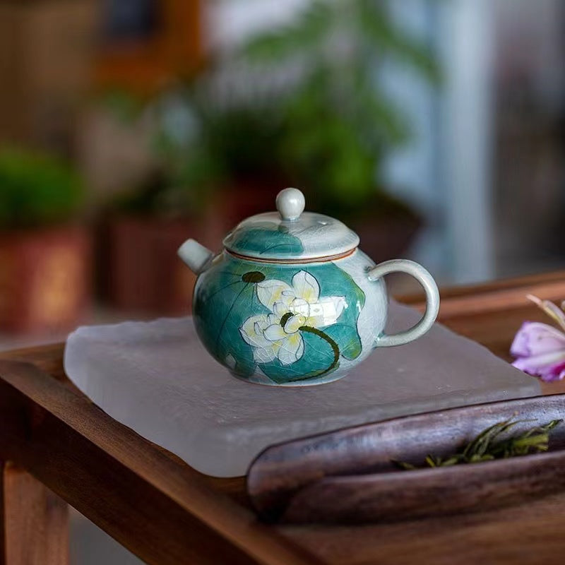 Handmade teapot with lotus flowers