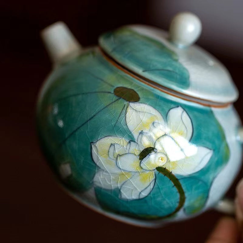 Handmade teapot with lotus flowers