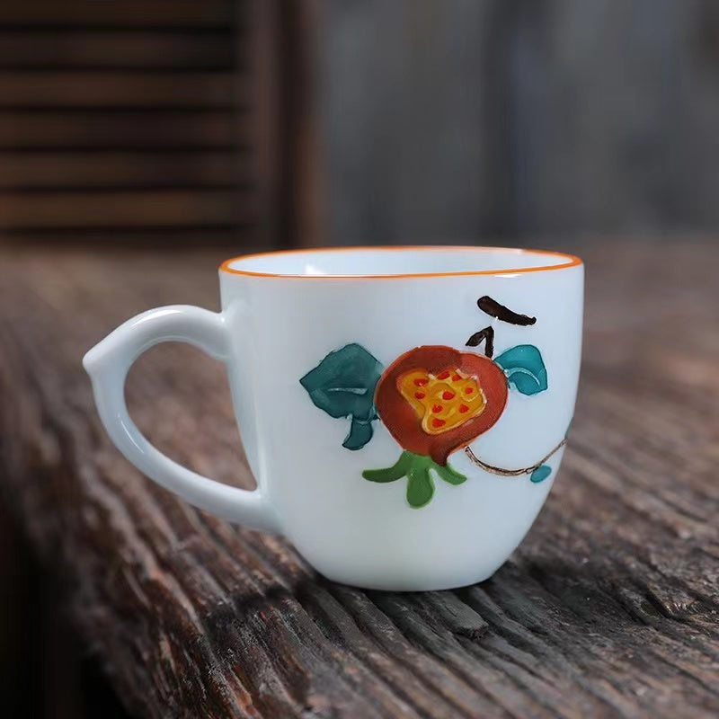 A bird and flower cup and a jug and a jug of water