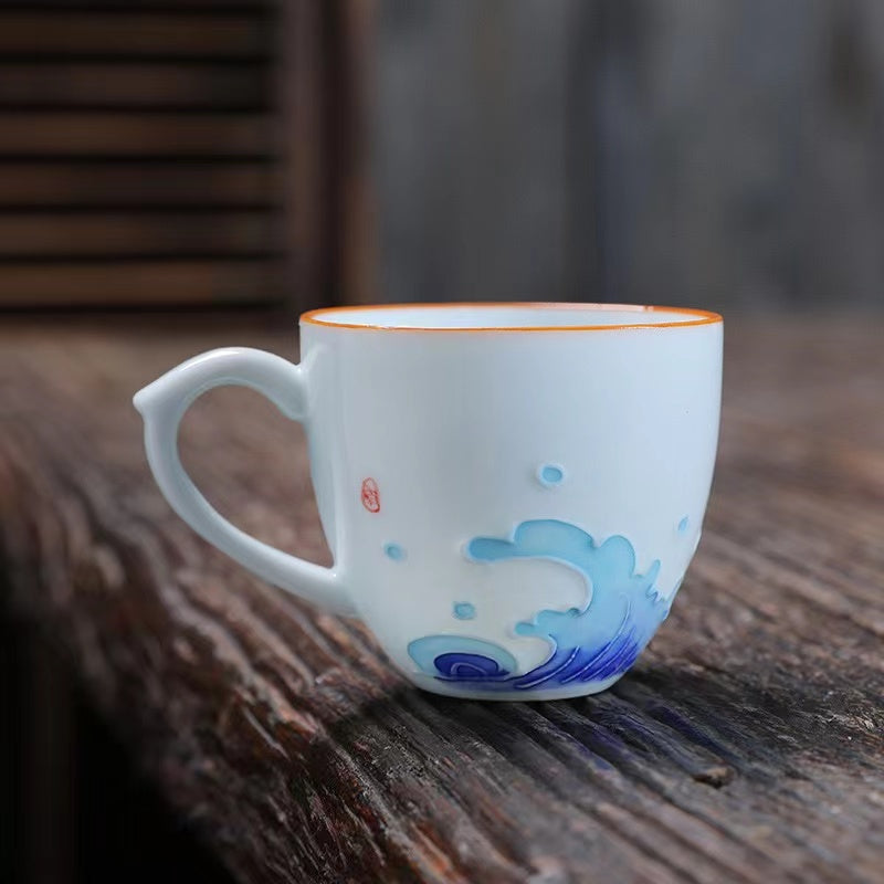 A bird and flower cup and a jug and a jug of water