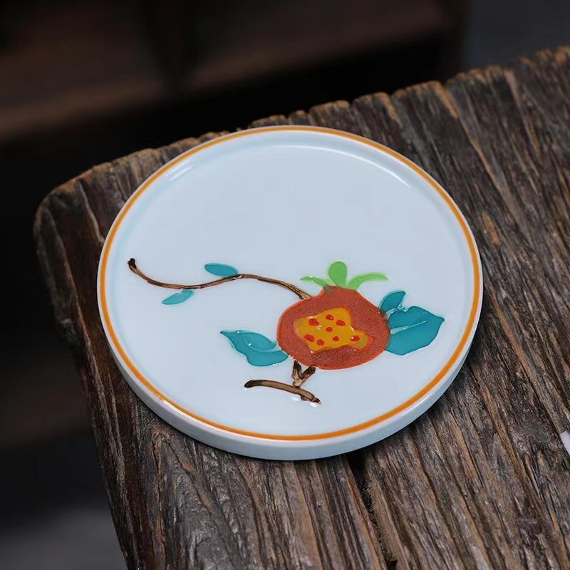 A bird and flower cup and a jug and a jug of water