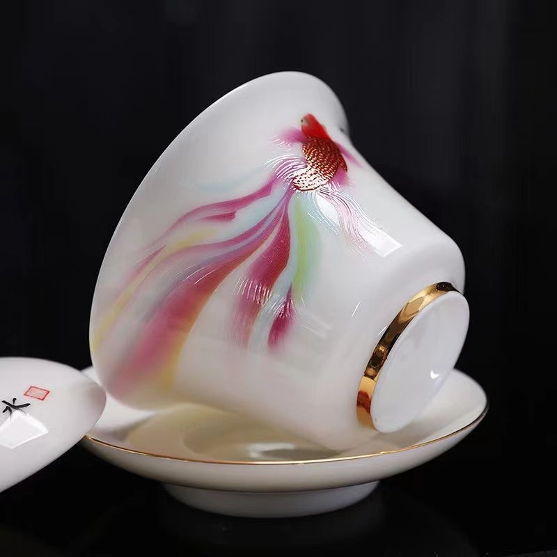 Dehua fine white porcelain gold-coloured goldfish tea bowl