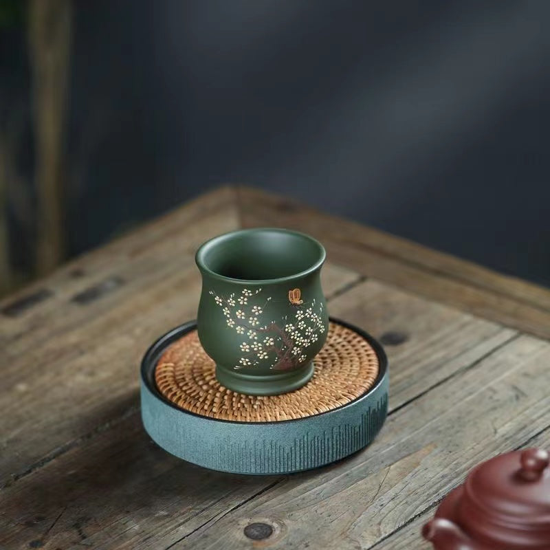 An original Yixing purple sand and mountain cement painted Teacup