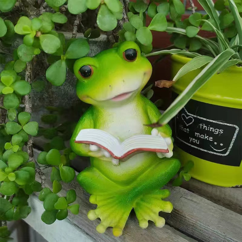 Resin frog rabbit reading a book