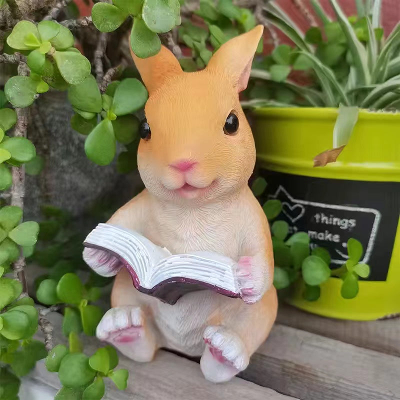 Resin frog rabbit reading a book