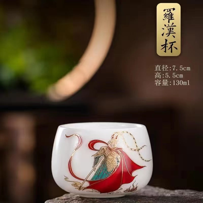 A hand-painted teacup with the Monkey King design in sheep's fat jade