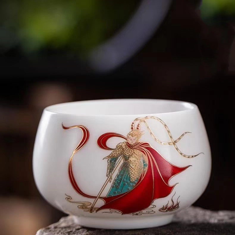 A hand-painted teacup with the Monkey King design in sheep's fat jade