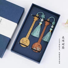 Load image into Gallery viewer, A hand-carved classical style bookmark in mahogany
