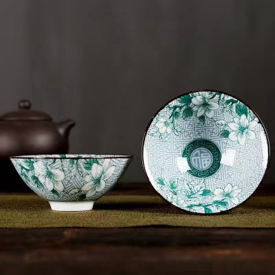 A blue and white porcelain tea cup with bucket cup