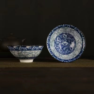 A blue and white porcelain tea cup with bucket cup