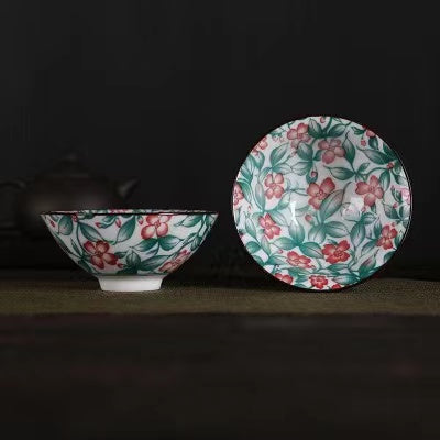 A blue and white porcelain tea cup with bucket cup