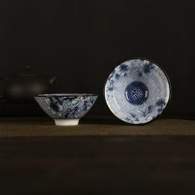 A blue and white porcelain tea cup with bucket cup