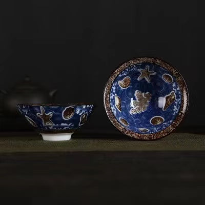 A blue and white porcelain tea cup with bucket cup