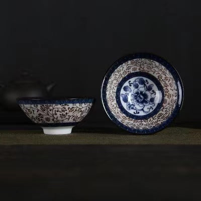 A blue and white porcelain tea cup with bucket cup