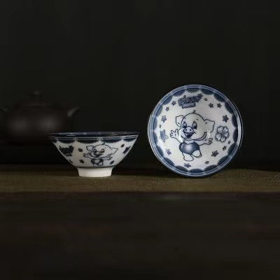 A blue and white porcelain tea cup with bucket cup