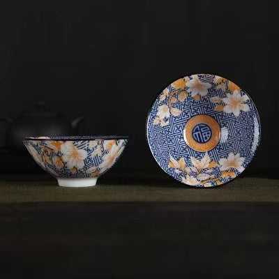 A blue and white porcelain tea cup with bucket cup