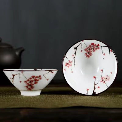 A blue and white porcelain tea cup with bucket cup