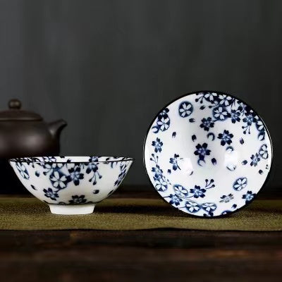 A blue and white porcelain tea cup with bucket cup