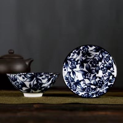 A blue and white porcelain tea cup with bucket cup