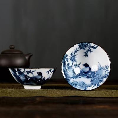 A blue and white porcelain tea cup with bucket cup