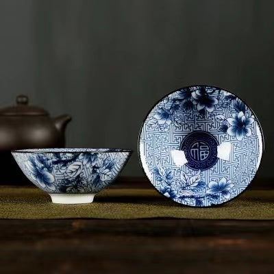 A blue and white porcelain tea cup with bucket cup