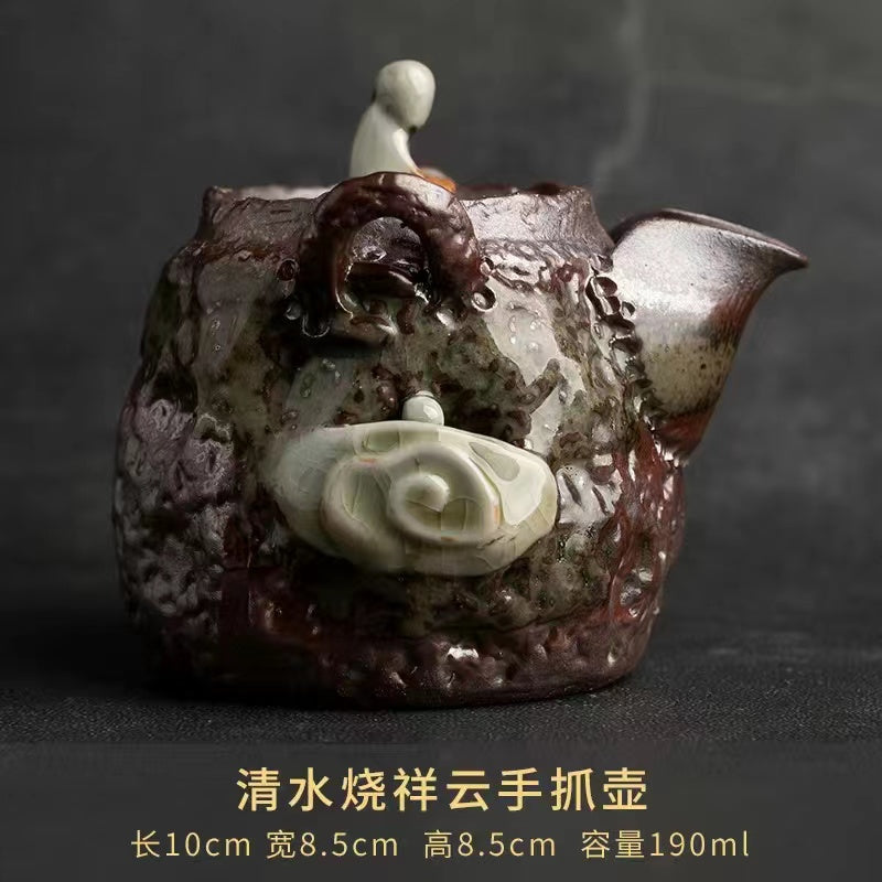 A Qing Shui wood-fired auspicious cloud hand-held pot