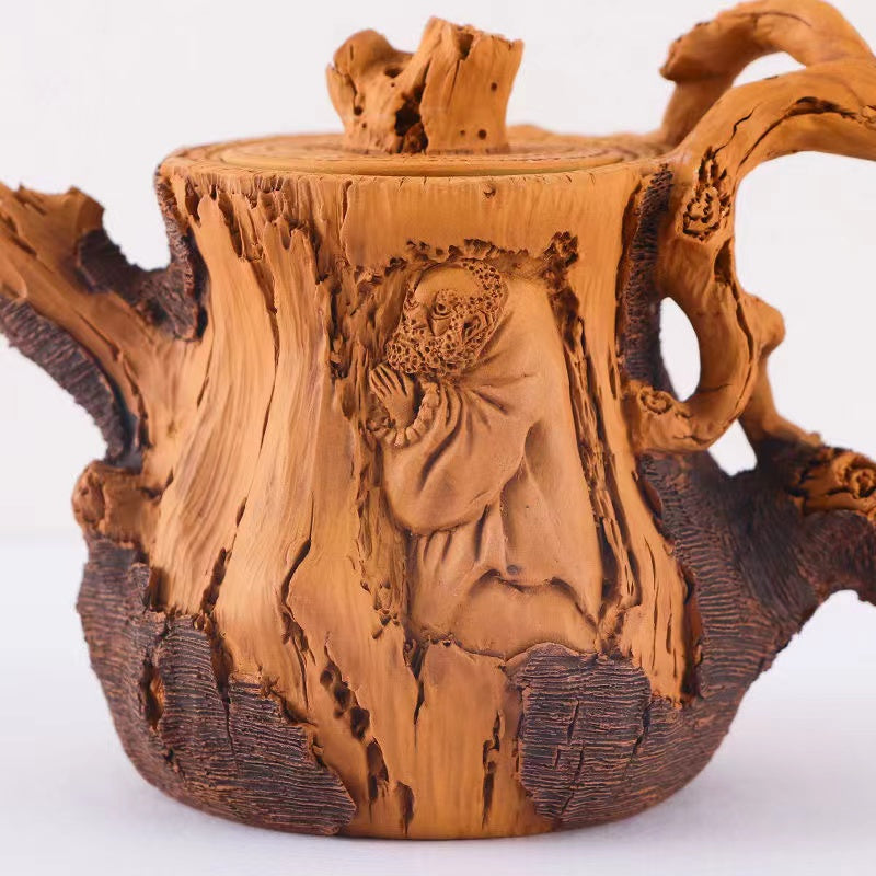 Master Collection------A purely handmade superior flower stump teapot in relief duan clay from Yixing(M541)