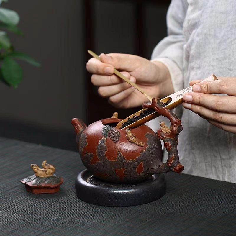 Yixing backflow pot imitating an old pot handmade squirrel and grape Teapot