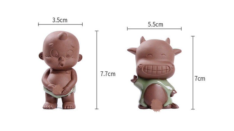 Peeing kids purple clay tea pet